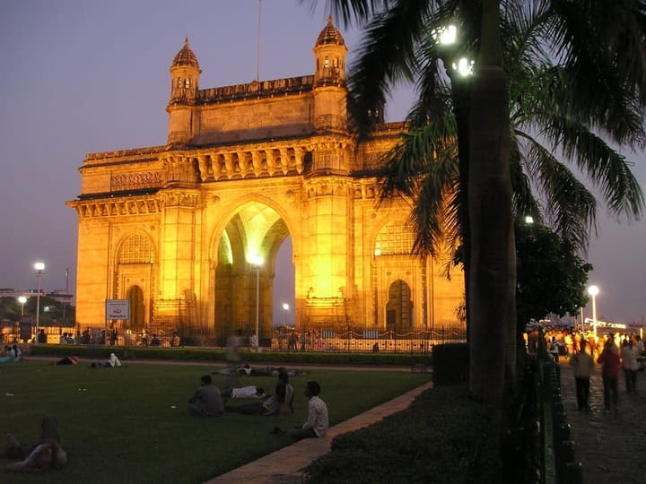The Gateway of India in Mumbai, floodlit at dusk